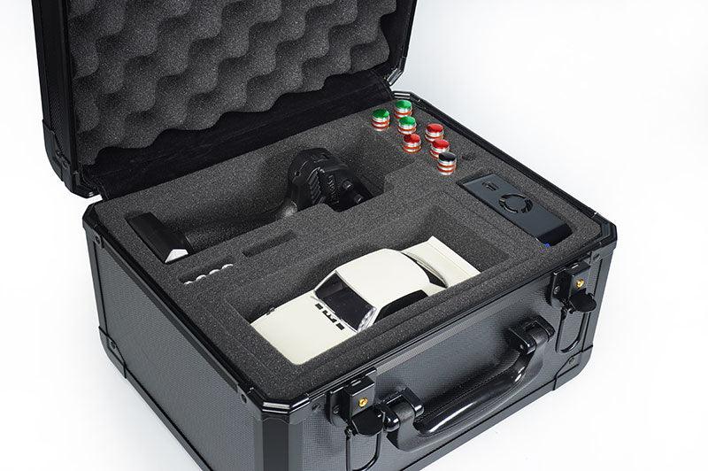 RC car storage case with foam interior, remote controller, tools, and accessories organized neatly