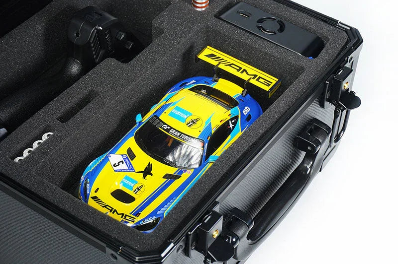 RC car storage case with foam insert holding a yellow and blue racing RC car and accessories