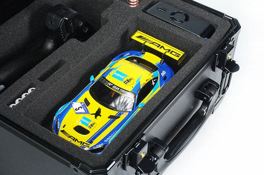 RC car storage case with foam insert holding a yellow and blue racing RC car and accessories