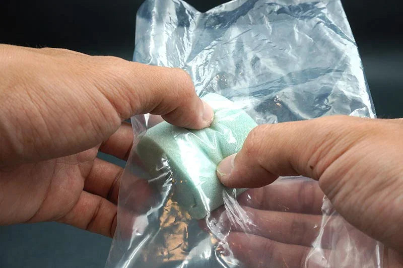 Koswork KOS50021 RC air filter foam insert, light green, held in hand inside clear plastic bag
