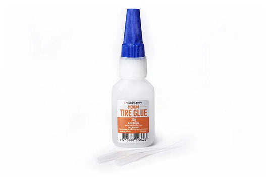 Medium tire glue bottle for RC cars with blue cap and precision applicator tips