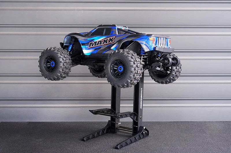 RC monster truck on adjustable pit stand, ideal for remote control car maintenance