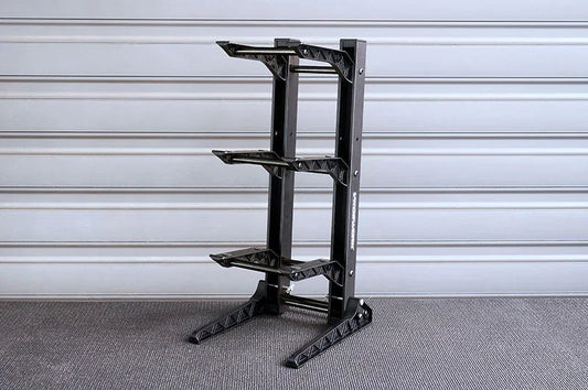 Three-tier black RC car display stand with sturdy frame on carpeted floor