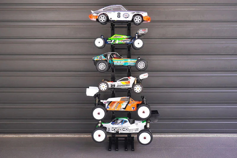Stacked display rack holding six remote control cars, ideal RC car storage and organization